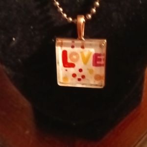 Square shaped glass pendant perfect for Valentines Day. Spells put 💕 Love.